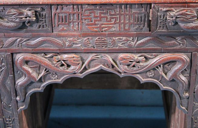044d - Heavily carved walnut Oriental desk with dragons